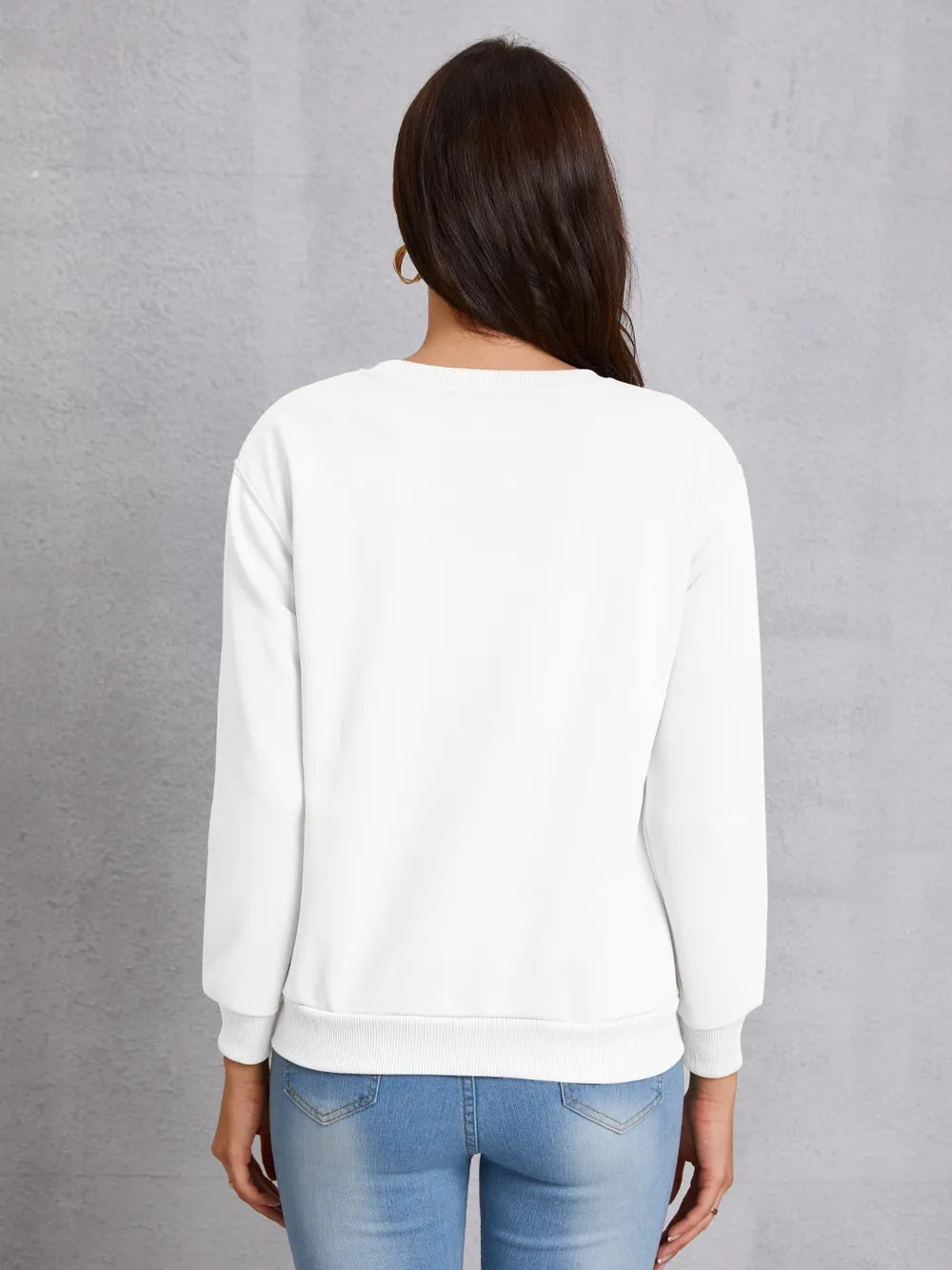 White crewneck sweatshirt with ribbed cuffs and hem, shown from the back.