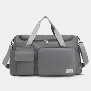 Dark Gray canvas duffel bag with multiple utility pockets and adjustable shoulder strap.