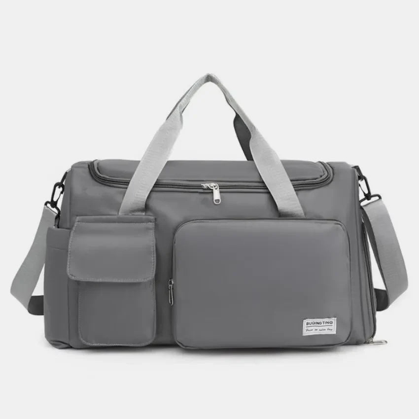 Dark Gray canvas duffel bag with multiple utility pockets and adjustable shoulder strap.