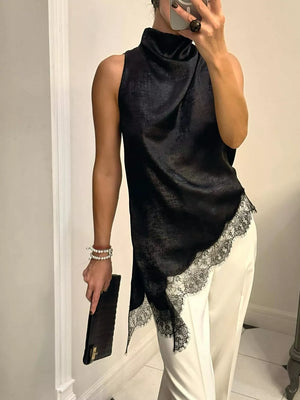 Black asymmetrical cami top with lace trim and draped neckline.
