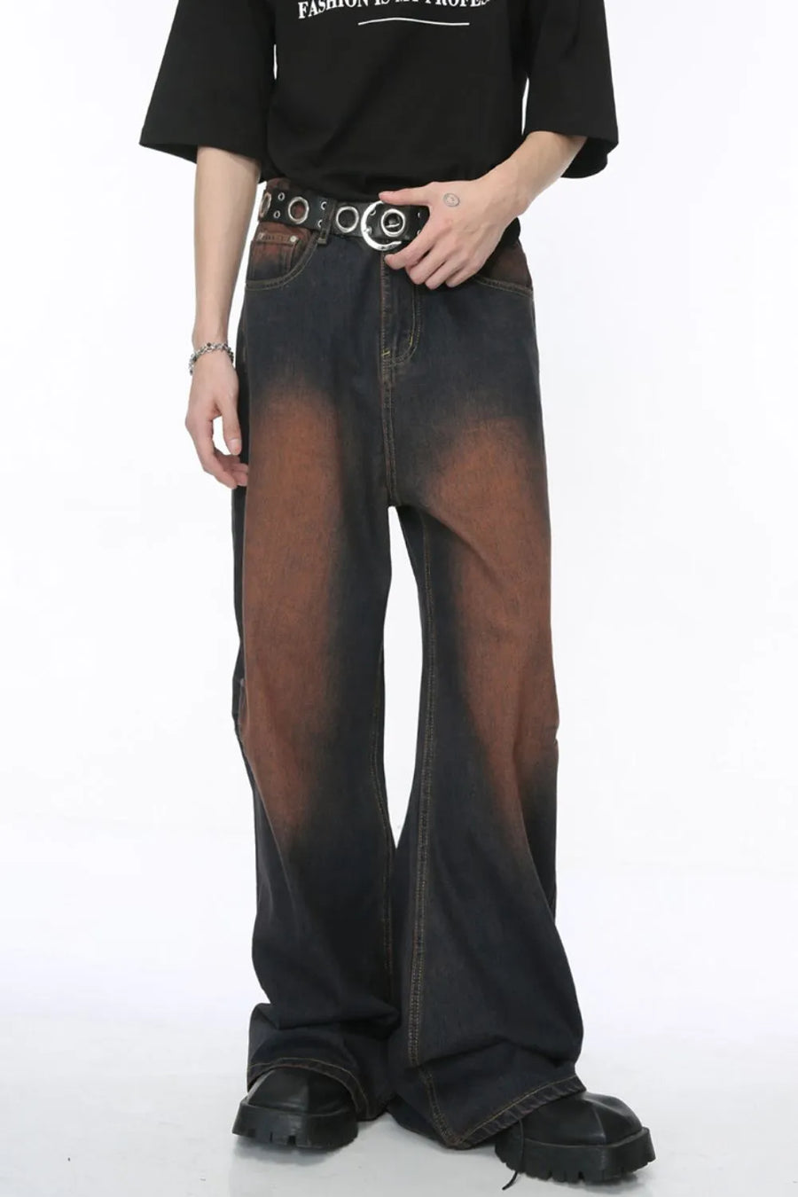 Acid wash flare jeans in dark denim with a gradient brown pattern and silver stud detailing.