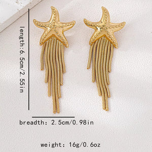earrings in Gold with motif and fringe
