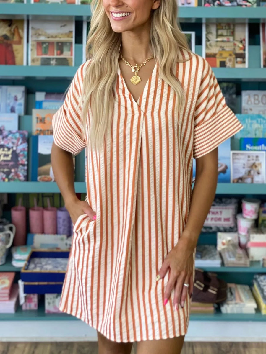 Striped V-neck shift mini dress with short sleeves and pockets.