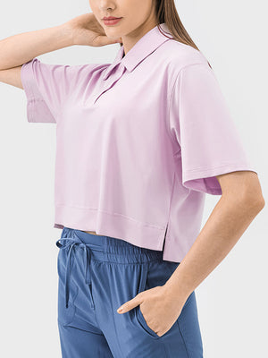 Cropped polo shirt in blush pink with short sleeves and a relaxed fit.