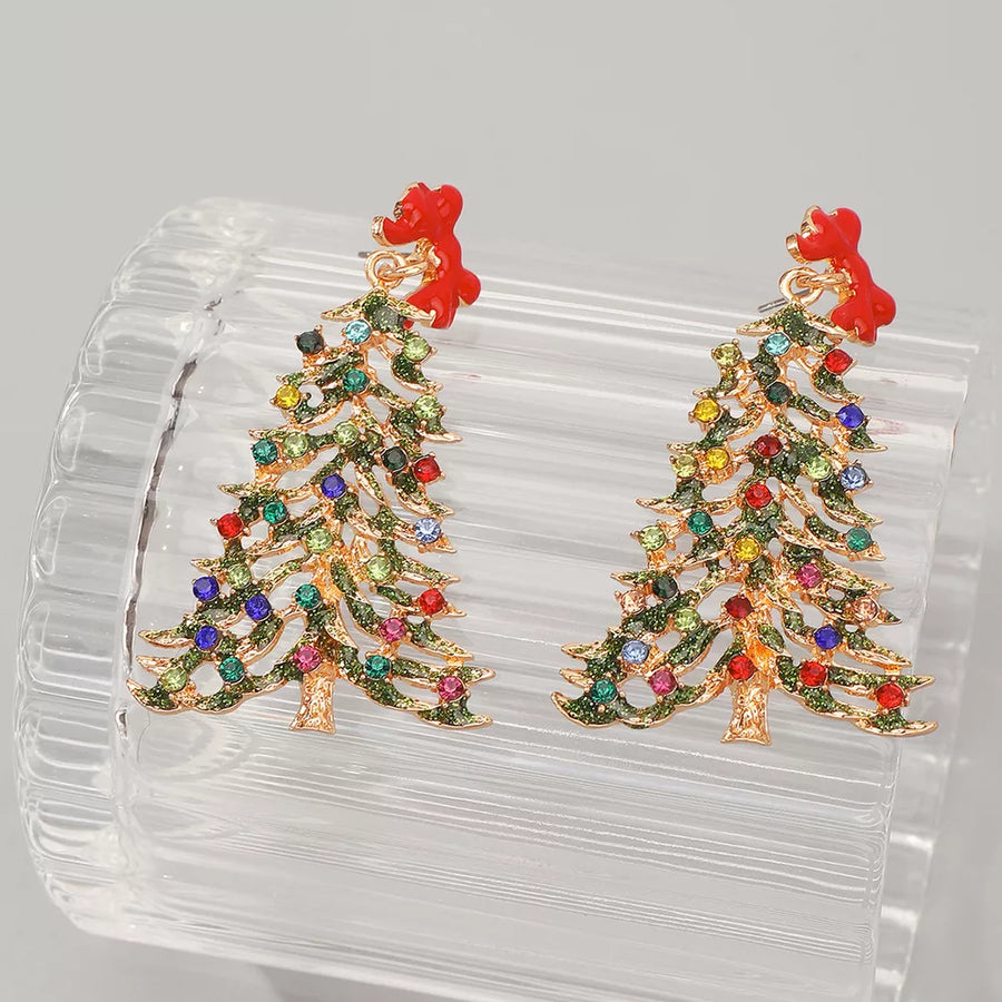 Festive dangle earrings shaped like Christmas trees with colorful rhinestones and red bows.