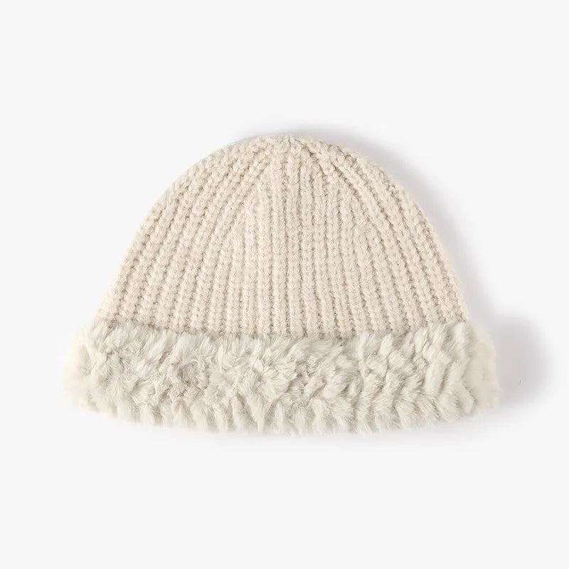 Beige ribbed knit beanie with faux fur trim detail