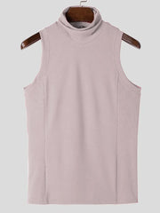 Sleeveless ribbed turtleneck shirt in blush pink with a high neckline.