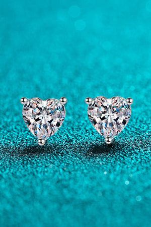 Silver heart-cut moissanite stud earrings with sparkling facets.