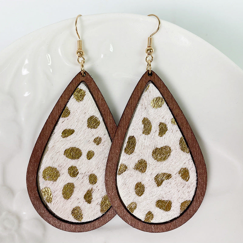 Leopard print teardrop wood earrings with gold spots and faux fur texture.