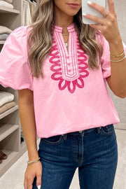 Pink cotton shirt with puff sleeves and embroidered neckline detail