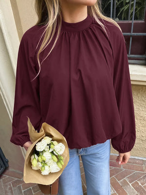 96% polyester, 4% elastane Care instructions: Machine wash cold blouse in burgundy with relaxed silhouette