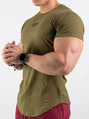 Olive performance tee with black logo detail and curved hem