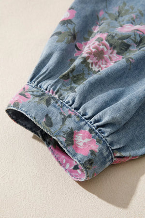 Denim button-up shirt with a floral print on the cuff and sleeve.