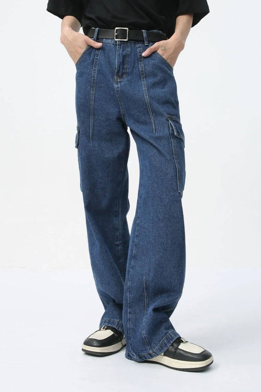 Wide-leg dark wash denim cargo pants with front seam detail and side pockets.