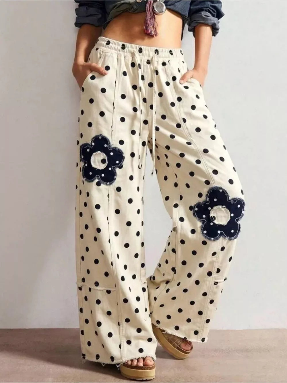 wide-leg jeans in cream featuring raw hem and wide-leg fit