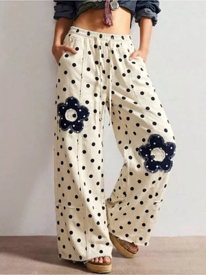 wide-leg jeans in cream featuring raw hem and wide-leg fit