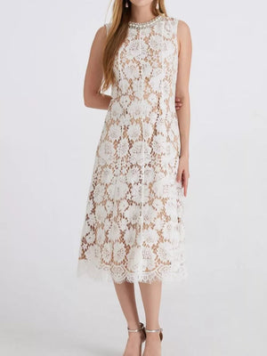 White lace dress with embellished neckline and scalloped hem