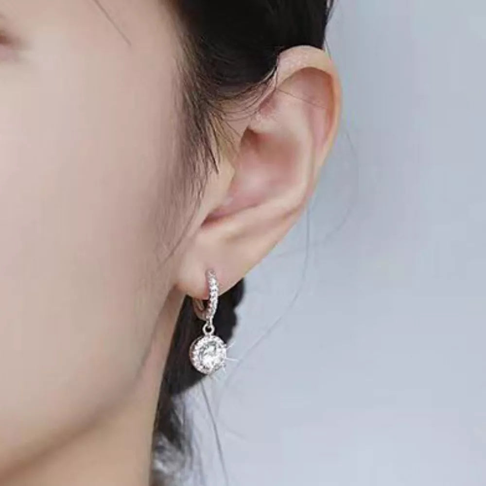 earrings in silver featuring moissanite stones and hoop drop fit