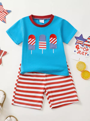 Baby boys outfit with blue t-shirt featuring popsicle graphics and red striped shorts.