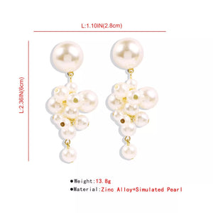 earrings in ivory with cluster design and long