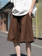Men's dark brown loose-fit casual shorts with pockets