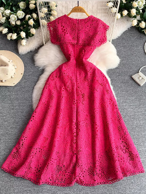 Fuchsia pink lace A-line dress with cutout details and scalloped hem.
