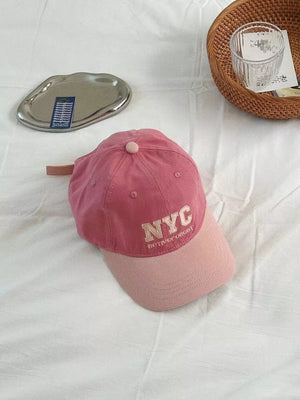 Light pink embroidered cotton baseball cap with NYC text detail.