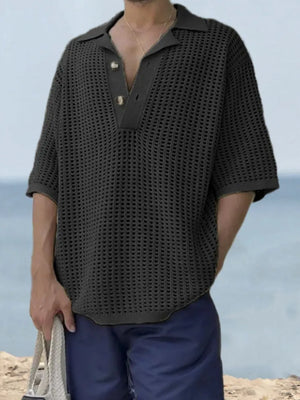 Open-knit polo shirt with pointed collar and two buttons in black.