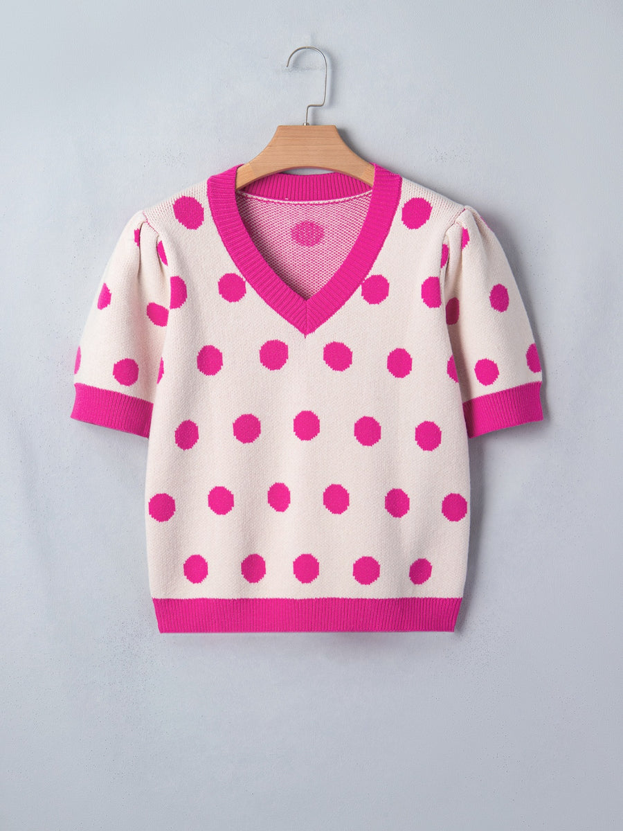 Cream polka dot knit top with hot pink trim and puff sleeves