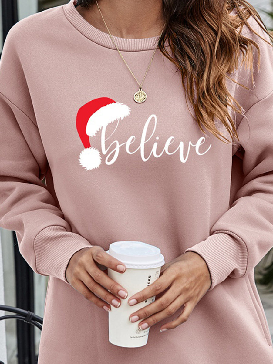 Dusty Pink Christmas graphic tunic sweatshirt with Santa hat and "believe" text.