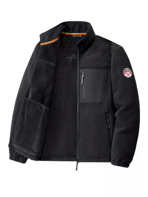 Black fleece jacket with zip pockets and orange trim on collar.