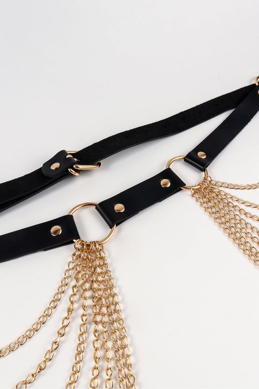 Black leather waist harness with gold chain detailing and gold hardware.