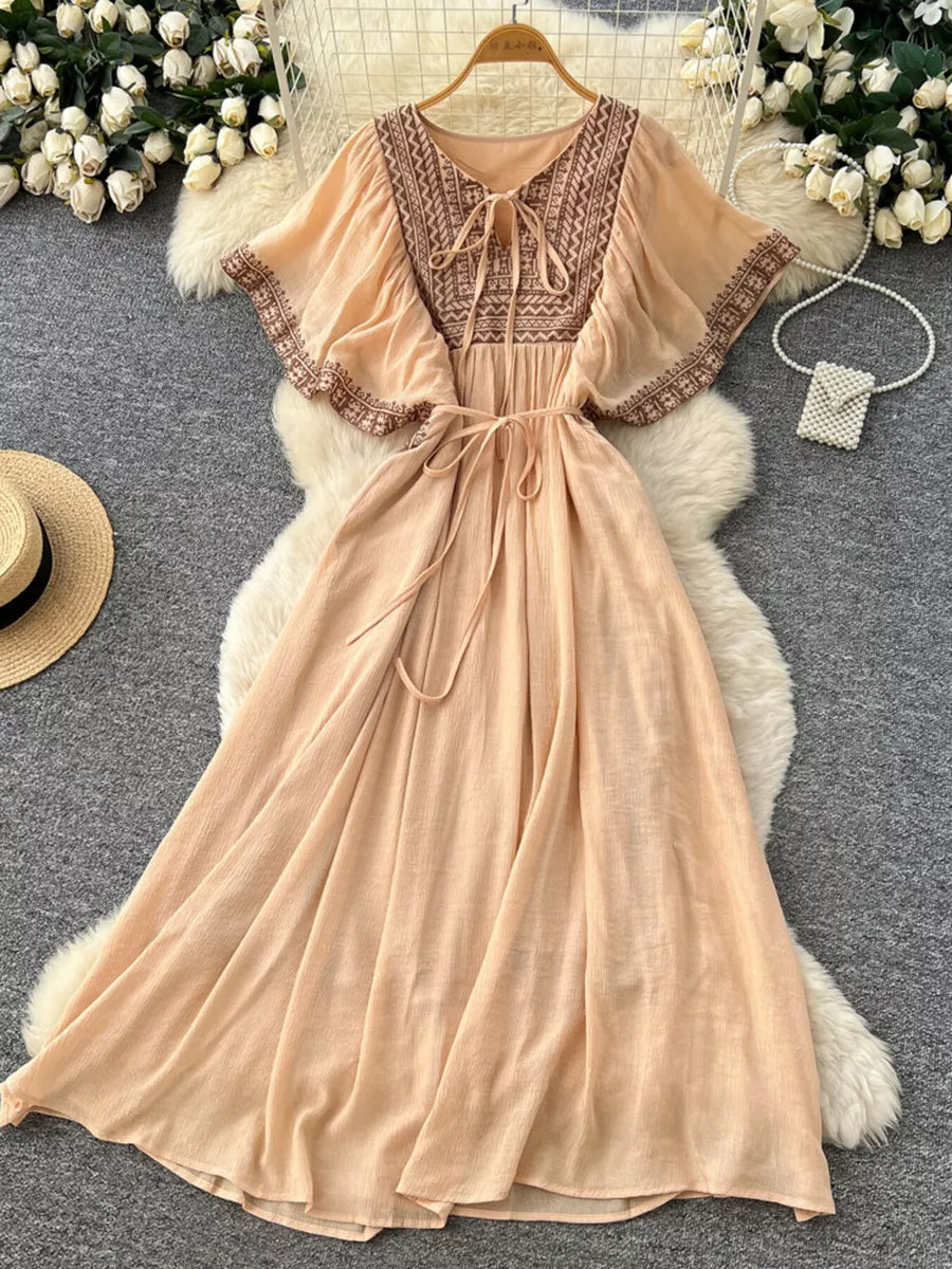 Peach V-neck maxi dress with embroidered yoke and flutter sleeves, tie waist, boho style