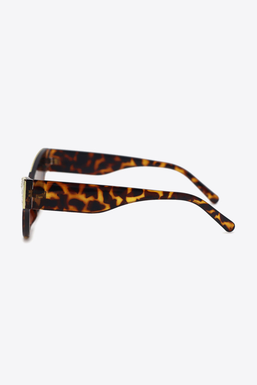 Tortoiseshell cat-eye sunglasses with crystal embellishments on acetate frames.