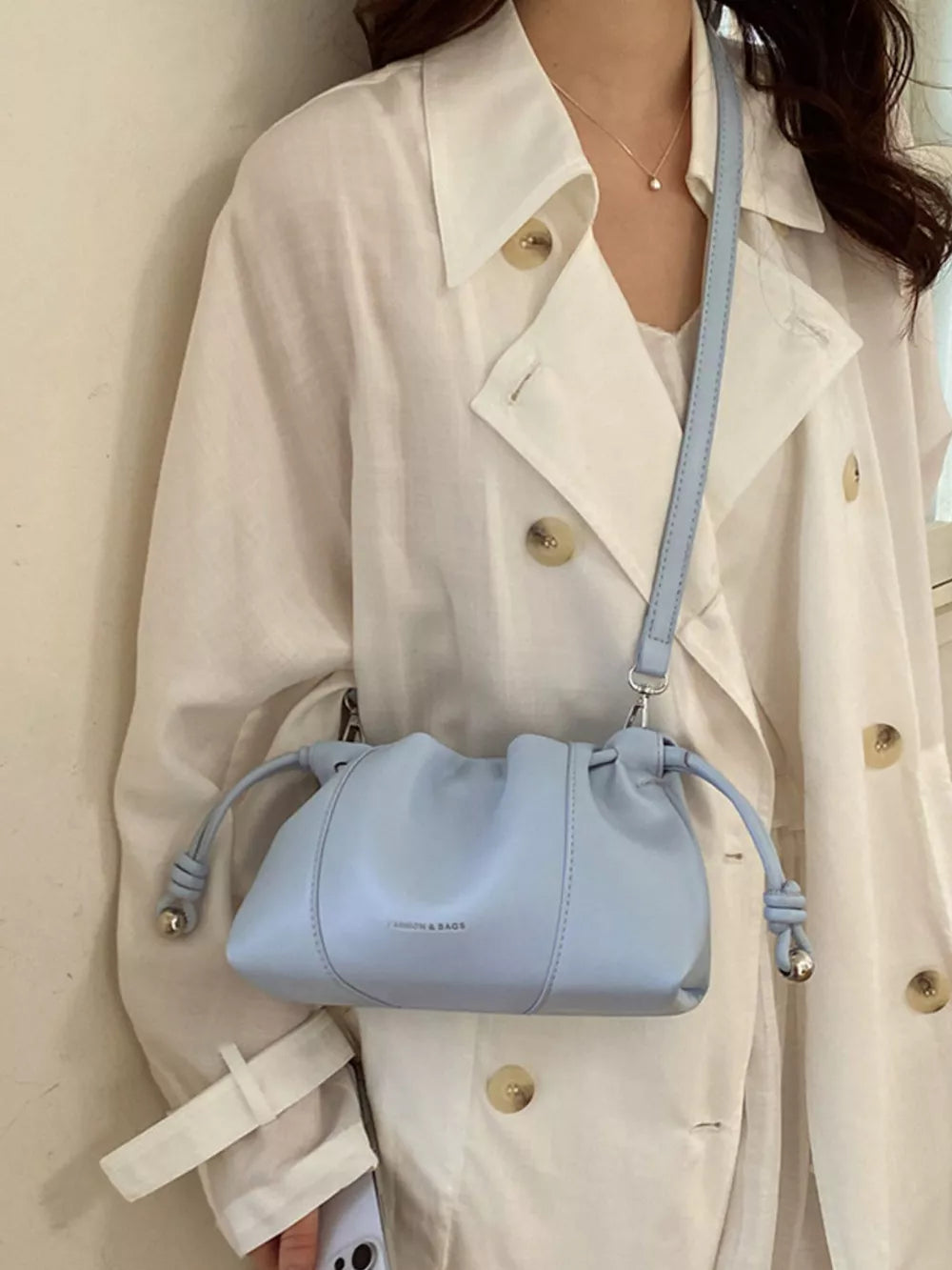 Drawstring Leather Crossbody Bag in black with drawstring closure