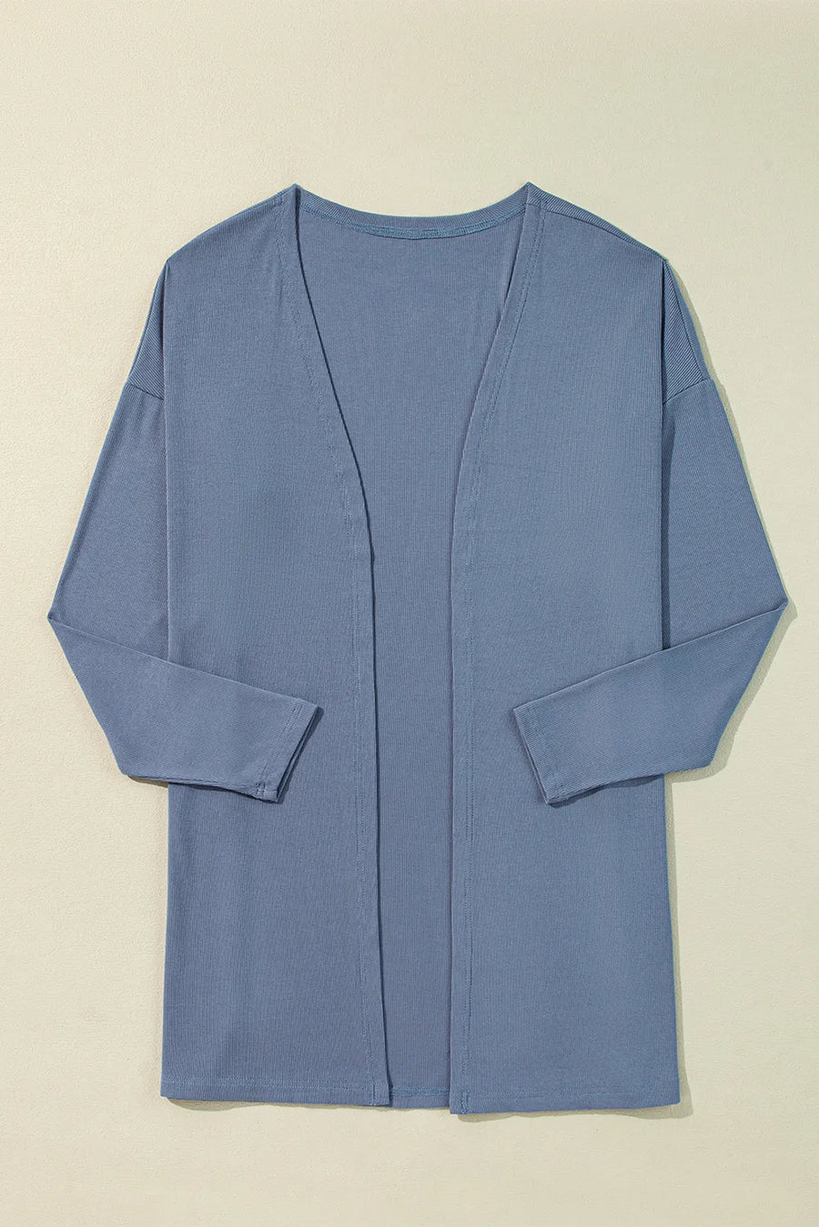 Dusty blue ribbed knit open front cardigan with long sleeves and side slits.