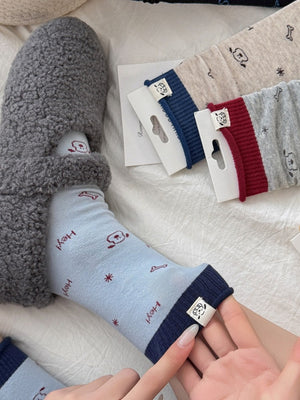 light blue socks featuring ribbed cuff and cartoon-print