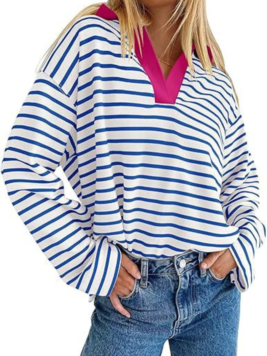 Oversized blue and white striped long-sleeve sweatshirt with a pink v-neck collar.