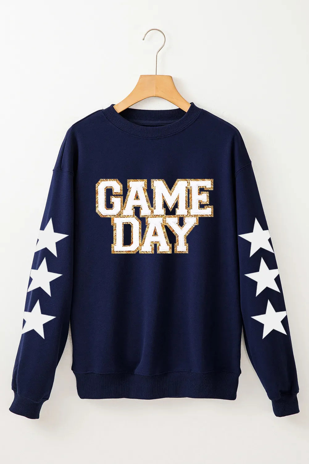 Navy sweatshirt with "GAME DAY" graphic and white stars on sleeves.
