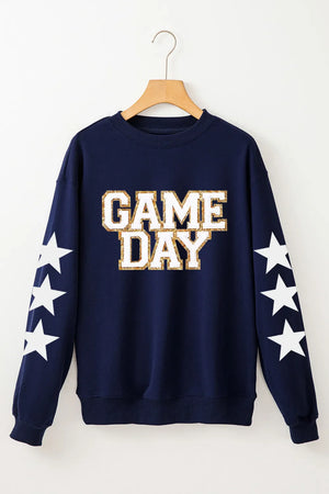 Navy sweatshirt with "GAME DAY" graphic and white stars on sleeves.