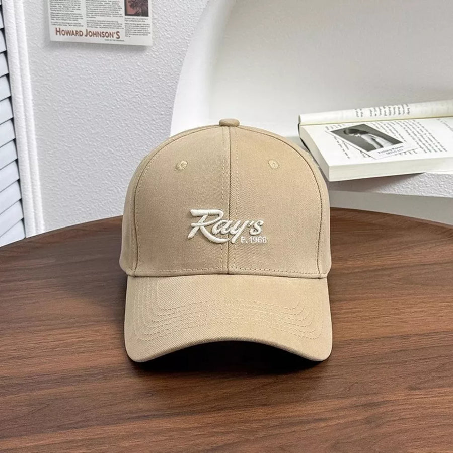 Tan baseball cap with white embroidered "Ray's E. 1968" logo.