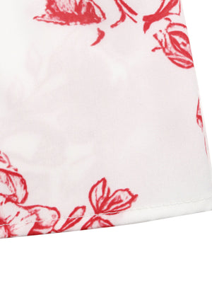 White maxi dress with red floral print and tie straps