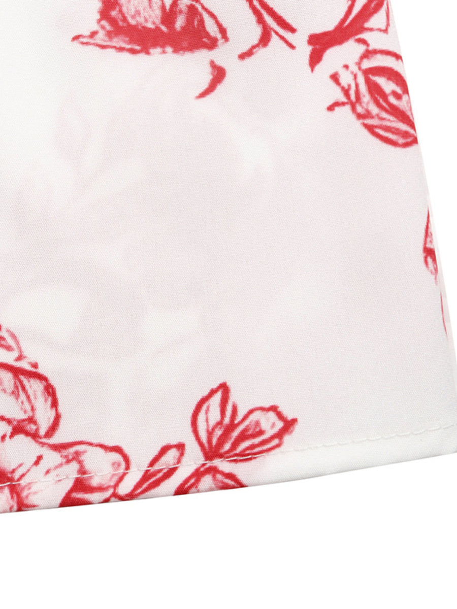 White maxi dress with red floral print and tie straps