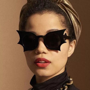 sunglasses in black featuring UV400 protection and boxy fit