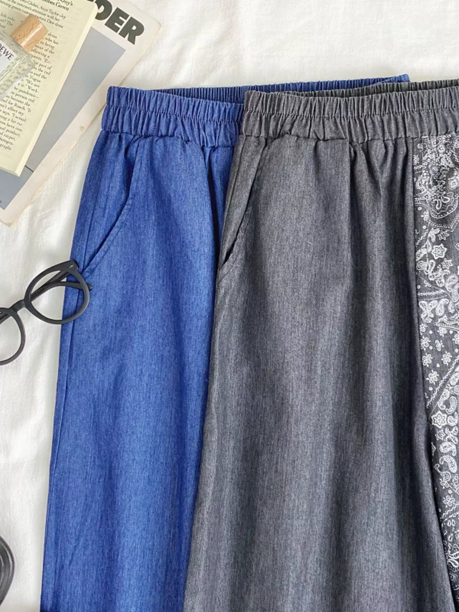 Blue and grey comfort jeans with drawstring waist and bandana print detail.