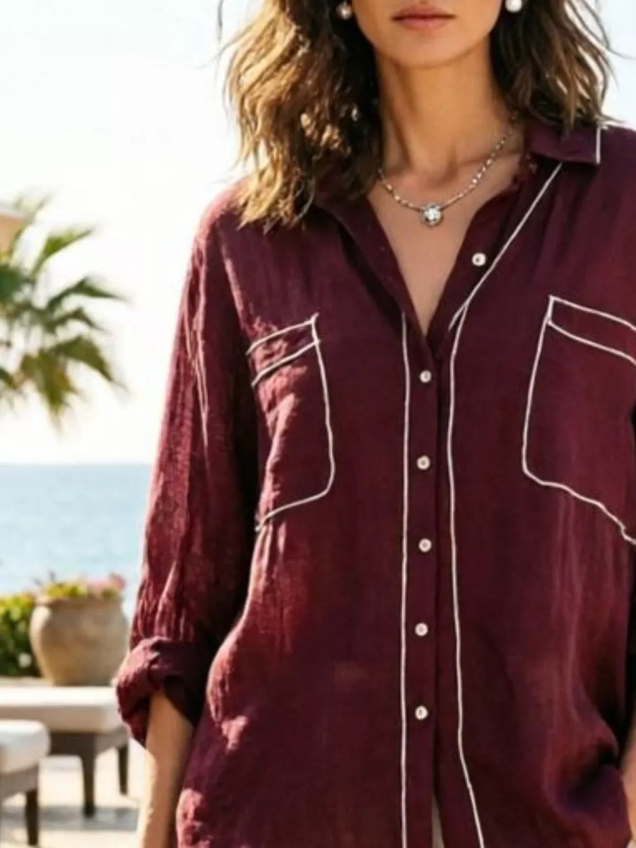 Burgundy linen button-up shirt with white piping and chest pockets.