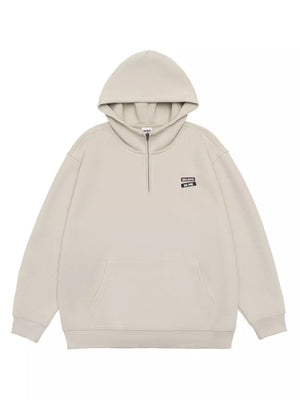 Plus-size beige quarter-zip hoodie with a front pocket and "Believe In Me" graphic.