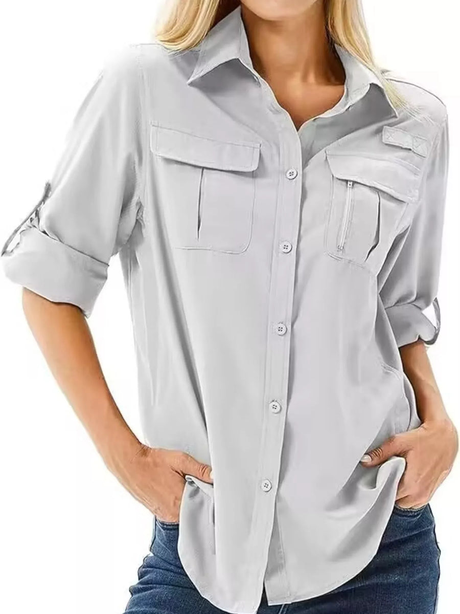 Light gray button-up shirt with roll-up sleeves and chest pockets.