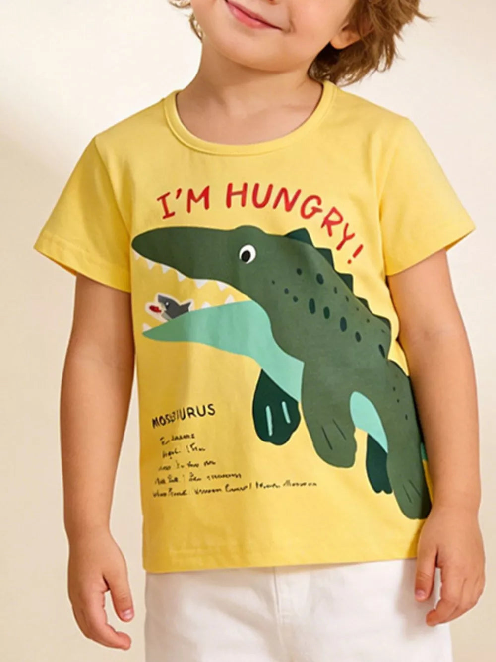 Yellow cotton t-shirt with Mosasaurus graphic and "I'M HUNGRY!" text.