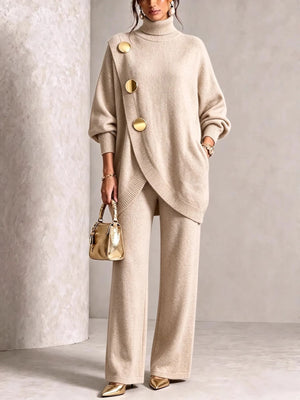 Black sweater and pants set with gold button accents and long sleeve